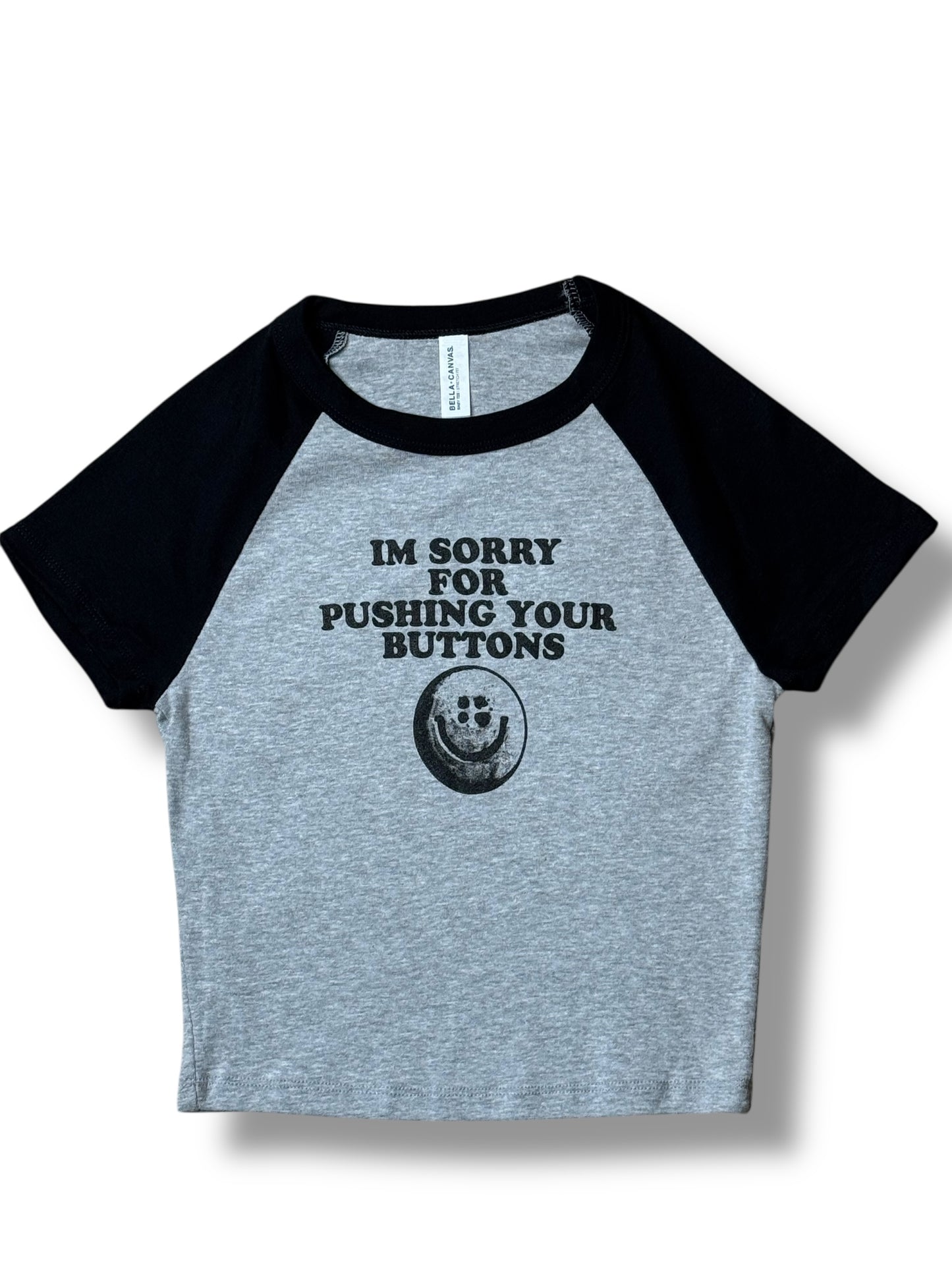 Pushing Your Buttons Ladies' Baby Tee (Black)